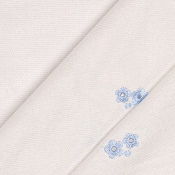 Tessuto Piquet di Cotone Ricamato - Fiore Celeste Fondo Bianco