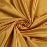 Tessuto Duchesse Elastica - al Metro - Oro