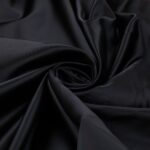 Tessuto Duchesse Regina Tabo Fissa - al Metro - Nero Riflesso Rosso